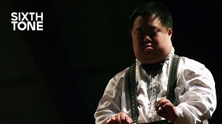 He’s China's Most Famous Conductor. He Also Has Down Syndrome.