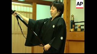 Swishing samurai swords revives martial art of Iaido.