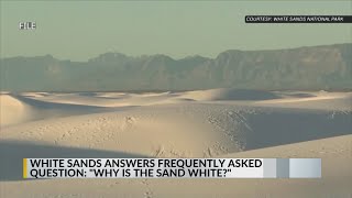 What gives the sand at White Sands National Park its color?