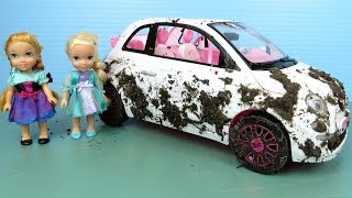 Elsa and Anna toddlers wash Barbie's cars