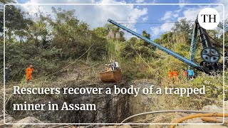 Assam coal mine tragedy:  Rescuers recover a body of a trapped miner