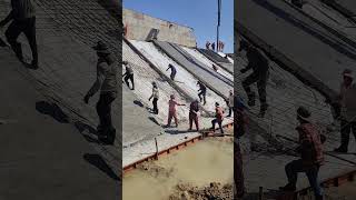 Workers try to lift and install slope rebar