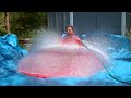 6ft Man in 6ft Giant Water Balloon - 4K - The Slow Mo Guys