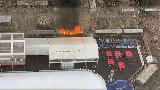 Flames shoot from booth at Bryant Park holiday market