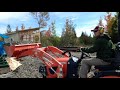 Using a Kubota to spread a  load of gravel