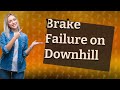 What is the first thing you should do if your brakes fail while going downhill?