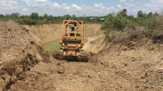 Bulldozer KOMATSU D31P fill the pond 1st day