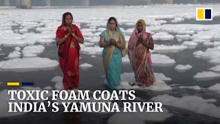 Mounds of toxic foam cover India’s sacred Yamuna river