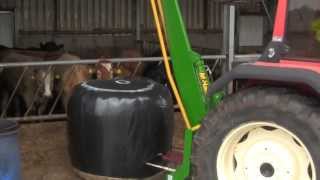 Feeding silage with Same Explorer \u0026 McHale 994 Round Bale Splitter 2013