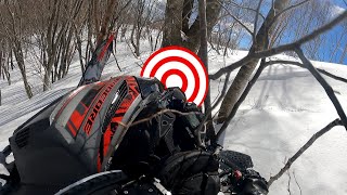 Arctic Cat Alpha One 154 HC in trees on hard spring snow, and why short days can be good days