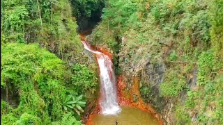 Drone shot over Pulang Bato Falls and Geothermal site of  Valencia Negros Philippines