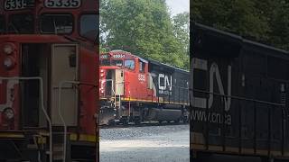 CN 5335 leading IC 1036 on a stopped tanker train!