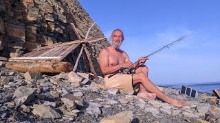 Construction of a hut on the seashore. A secluded life by the sea, in the wild.