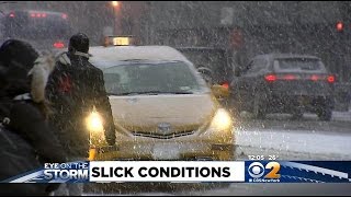 Wet Snow Creates Slick Driving Conditions In Manhattan