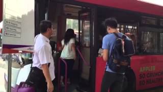 Commuters boarding the free shuttle bus at Hougang MRT station