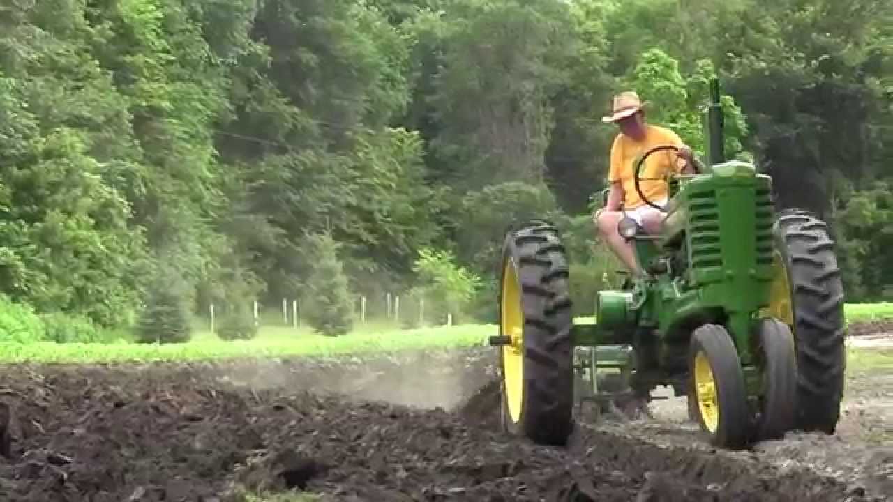 John Deere Tractor Plowing Field