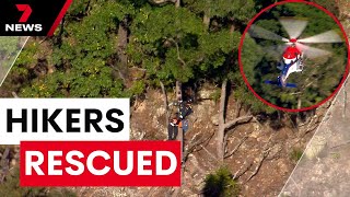 Four hikers rescued from Tamborine Mountains after spending night trapped on cliff face | 7NEWS