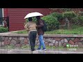 an unwell old man sits alone in the street on a rainy day what will passers by do