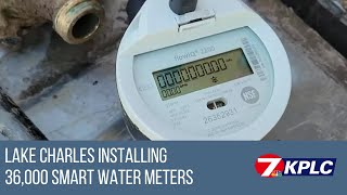 Contractor shows installation process for smart water meters
