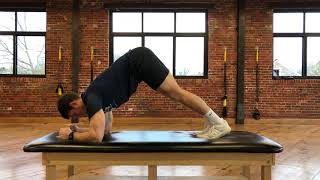 Serratus Plank (dolphin pose)