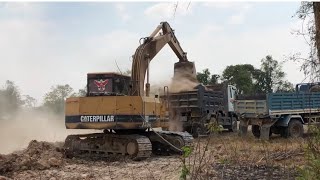 Powerful CAT Excavator in Action: Loading the land into Trolleys \u0026 Truck