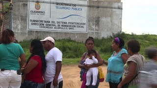 Relatives of inmates try to see their loved ones after riot
