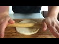 rolling dumpling wrappers into mandarin pancakes