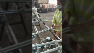 Girl in producing scaffold base jack