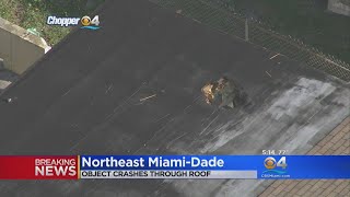 Woman Injured When Unidentified Object Falls From Sky, Crashes Through Roof
