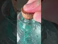 mica powder and clear goo in a potion bottle