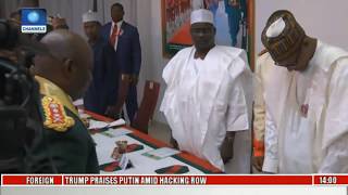 Buhari Receives Captured Boko Haram Flag