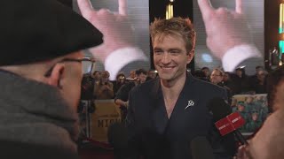 Dean talks to Robert Pattinson on the red carpet for  ‘Mickey 17’