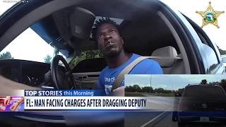 Video shows suspect dragging deputy with car
