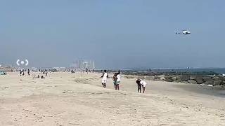 Divers search for missing 18-year-old swimmer at Rockaway Beach