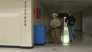 Classes back in session at closed down school in Montgomery Co. while law enforcement officers u...