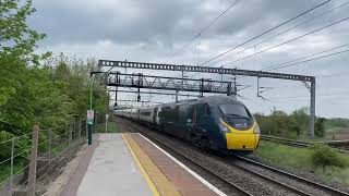 Trains at speed at polesworth least used station Avanti pride Royal Mail network rail class 56 56081