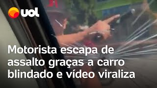 Motorista de carro blindado filma momento em que bandido armado tenta quebrar vidro e vídeo viraliza