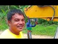 loading komatsu excavator pc200 to self loading truck