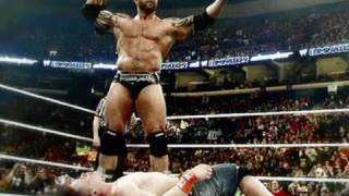 Batista steals the WWE Title from John Cena at WWE