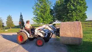 bobcat 2025 tractor moving 800 lb round bales