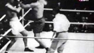 Demspey knocked out of the ring by Firpo