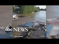 Cabin swept away by flood, crashes into bridge