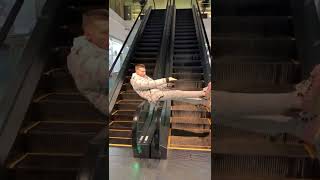 Guy is spinning on the handrails of an escalator! #shorts