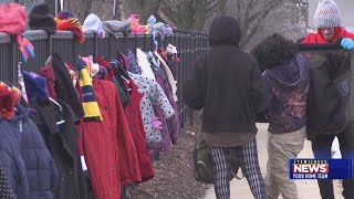 Church volunteers donate bags of free winter clothing for the homeless