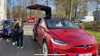 Presenting my red Tesla model X to my family