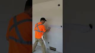How to tape a drywall joint by hand.