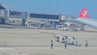 Airport Ground crew waving goodbye to passengers in Osaka