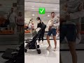 mom unfolds her stroller one handed while still holding her sleeping baby momlife twinmom babies