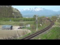 十勝岳連峰と空知川を渡る国鉄色キハ40 local train of nemuro line with mt.tokachi mountain range hokkaido japan