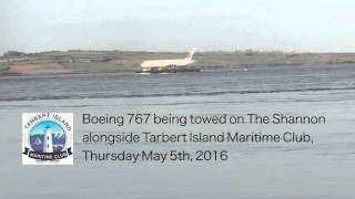 Boeing 767 being towed past Tarbert Island Maritime Club